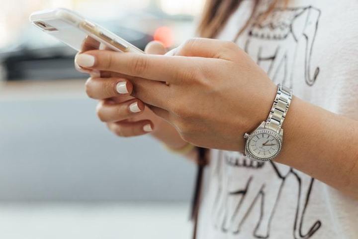 Woman recording on her mobile phone.