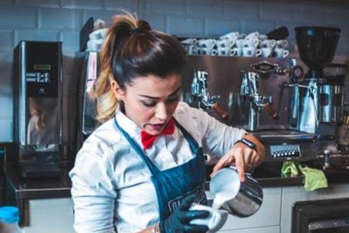 Barista pouring coffee.